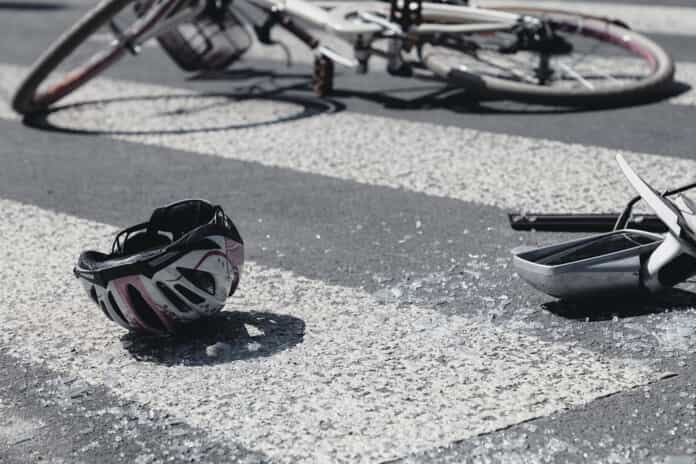 bike helmet laying on asphalt