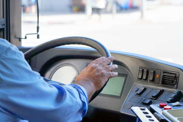 bus driver behind the wheel